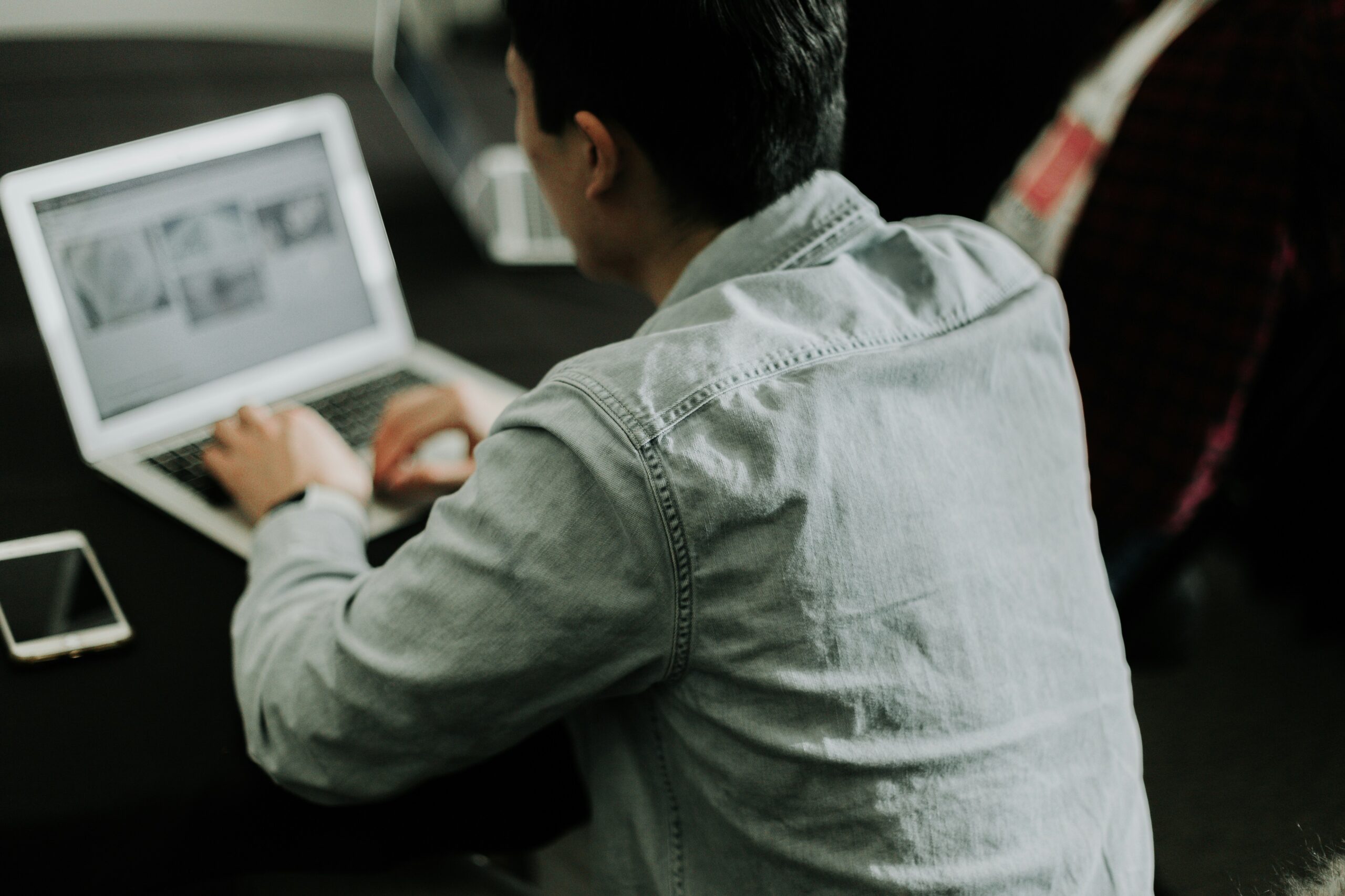 nonprofit person typing on a laptop.